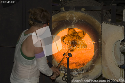 Image of Glass furnace. Glass Blower at Work