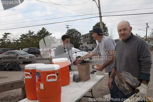 Image of NEW YORK - November 12: Volunteers and workers helping people af