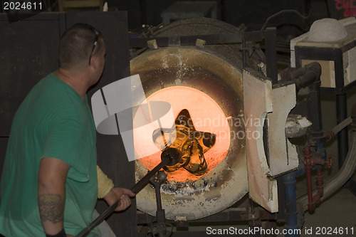 Image of Glass furnace. Glass Blower at Work