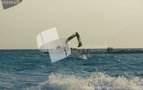 Image of Yellow Excavator at Work