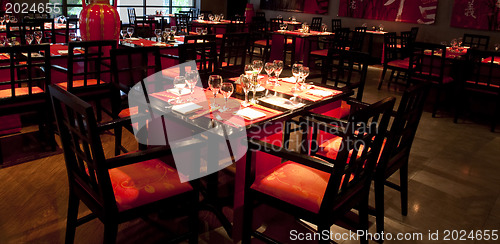 Image of Restoraunt table set awaiting guests