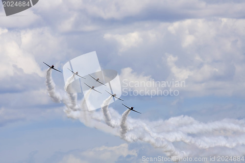 Image of Several  planes performing in an air show