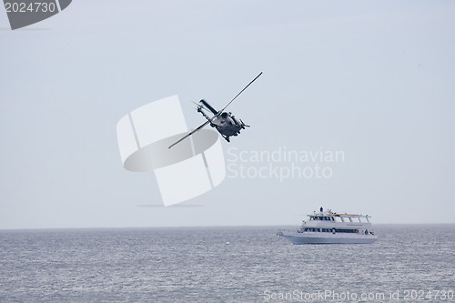Image of Helicopeters hovering over  ship