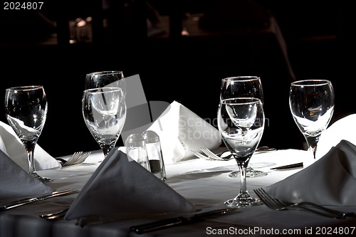 Image of Restoraunt table set awaiting guests