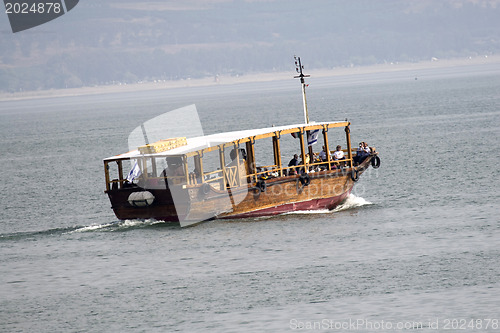 Image of Tourists floating on a boat on the sea of Galilee