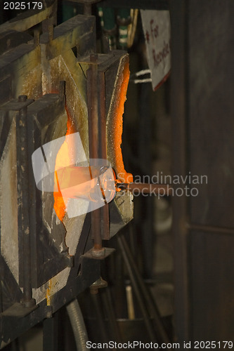 Image of Glass furnace. Glass Blower at Work