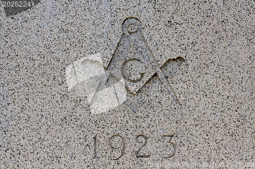 Image of Traditional masonic symbol on marble wall 