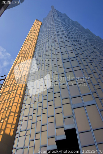 Image of Mahhattan .Urban view at modern glass building with  blue sky