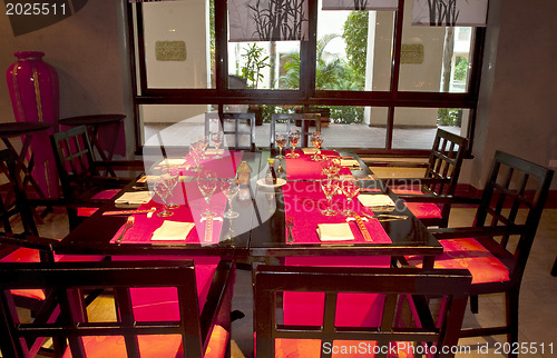 Image of Restoraunt table set awaiting guests