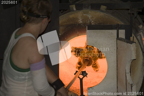 Image of Glass furnace. Glass Blower at Work