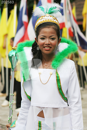 Image of Beautiful young Thai marching band member participates in a para