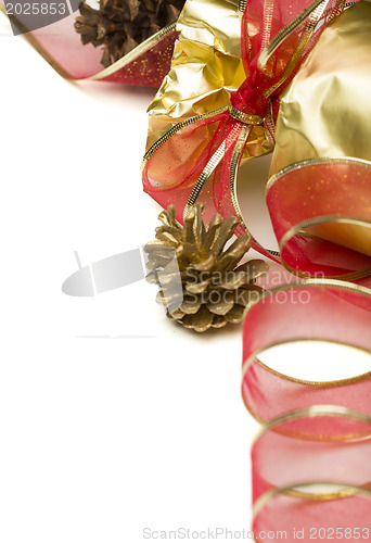 Image of Christmas Present with Red Ribbon and Pine Cones on White