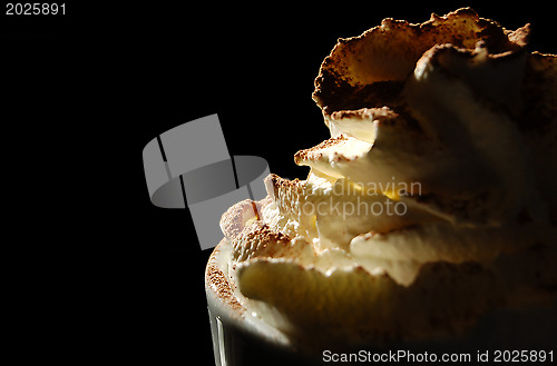 Image of Hot chocolate topped with whipped cream and dusted with cocoa