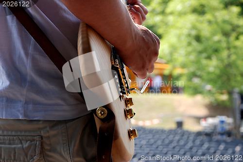 Image of Guitarist plays during a soundcheck on stage