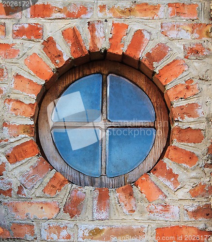 Image of Round window on brick wall on castle