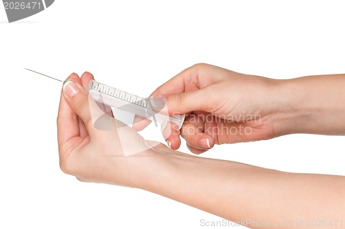 Image of Hand with syringe