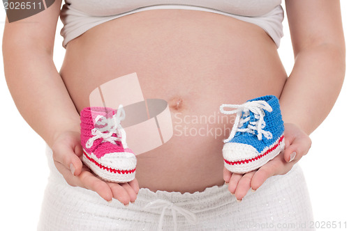 Image of Pregnant woman with baby's bootees