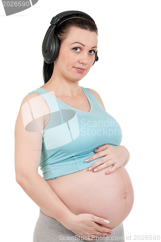 Image of Pregnant belly with headphones