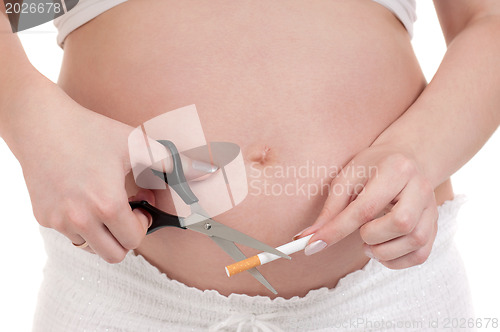 Image of Pregnant belly with cigarettes