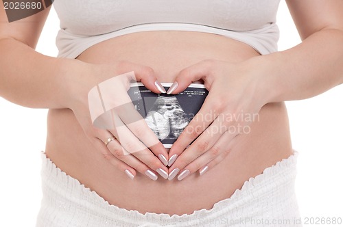 Image of Pregnant with photo of her Ultrasound