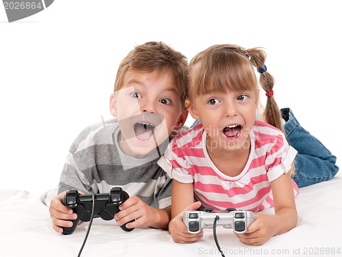 Image of Happy girl and boy playing a video game