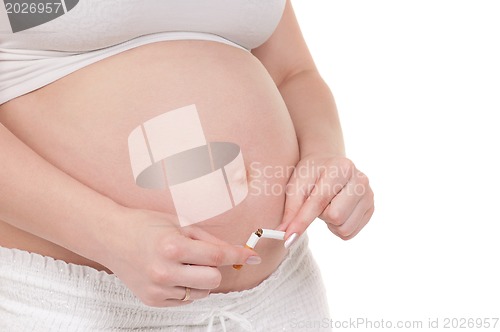 Image of Pregnant belly with cigarettes