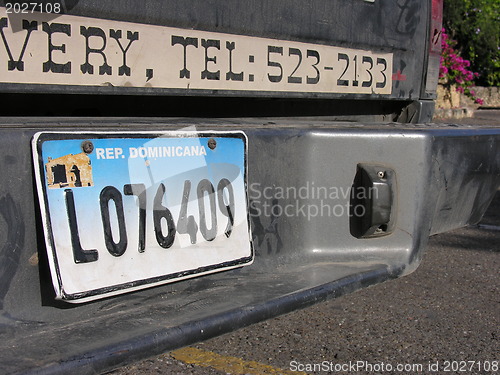 Image of SANTO DOMINGO, DOMINICAN REPUBLIC - DEC 20: Old car stops at tra