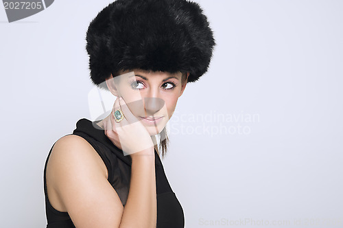 Image of Beautiful woman modeling a fur hat