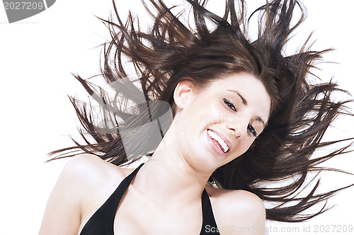 Image of Laughing carefree woman l tossing her hair