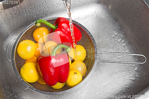 Image of Washing colorful fruits and vegetables