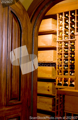 Image of mahogany door and wine cellar