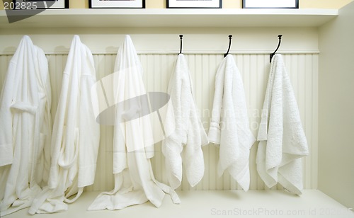 Image of locker room with bathrobes towels