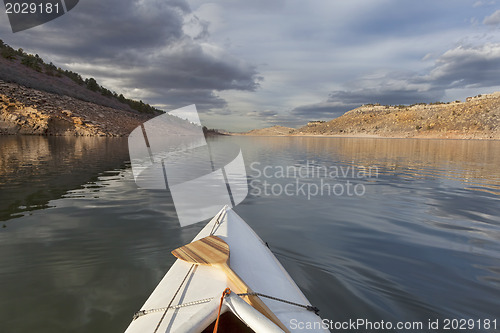 Image of canoe on mountain lake