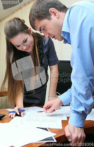 Image of Girl and man working in the office
