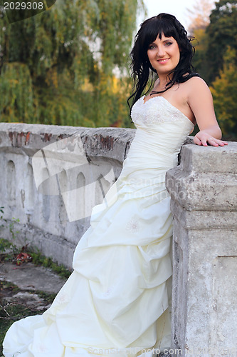 Image of Girl in the wedding dress in the park