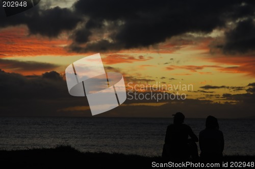 Image of Couple enjoying sunset