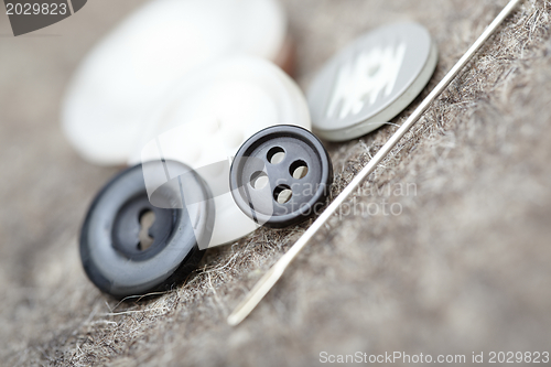 Image of Buttons and needle