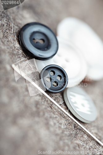 Image of Buttons and sewing needle