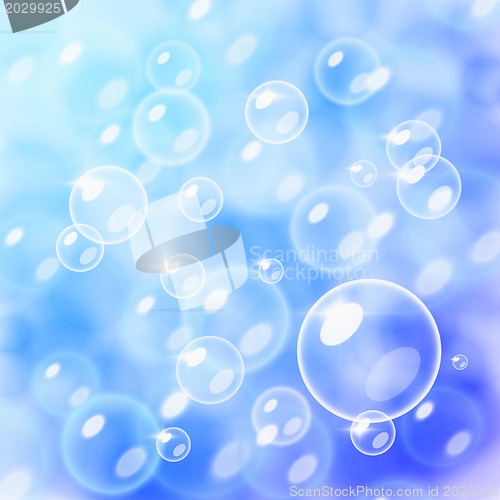 Image of Blurred bubbles over blue