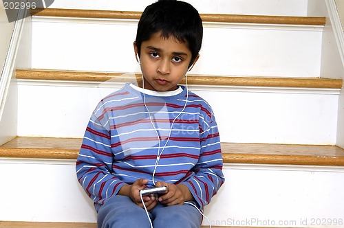 Image of Kid listening to music