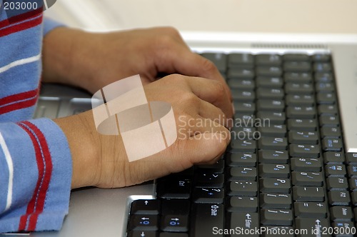 Image of Typing on a Laptop