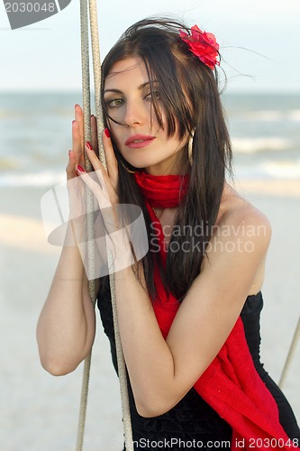 Image of woman sitting on a swing