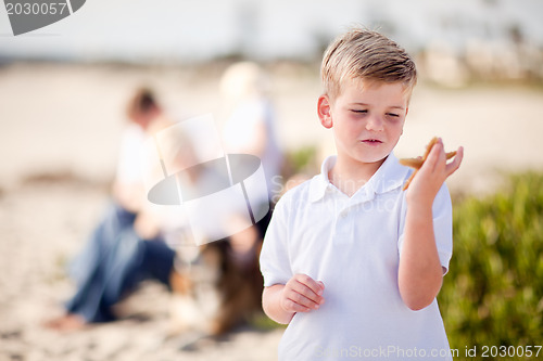 Image of Cute Little Blonde Boy Holding His Starfish