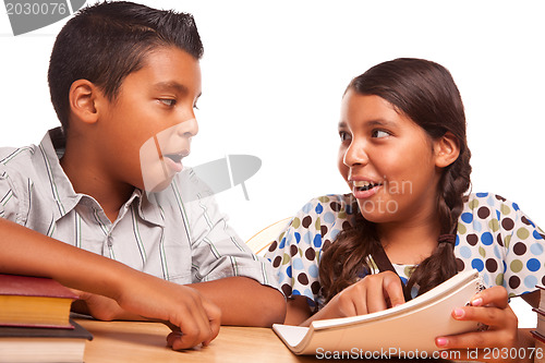 Image of Hispanic Brother and Sister Having Fun Studying