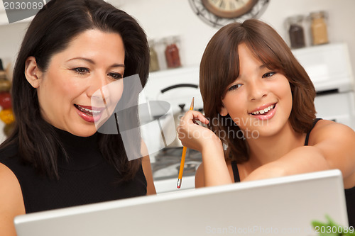 Image of Hispanic Mother and Mixed Race Daughter on the Laptop