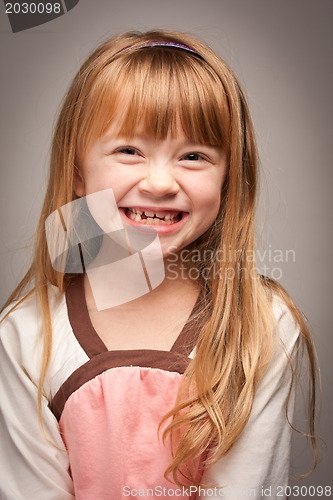 Image of Fun Portrait of an Adorable Red Haired Girl on Grey