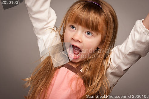 Image of Fun Portrait of an Adorable Red Haired Girl on Grey