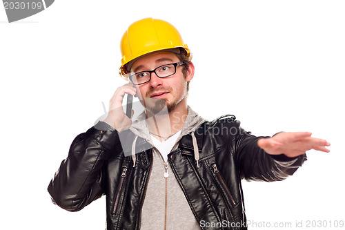 Image of Handsome Young Man in Hard Hat on Phone
