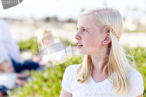 Image of Adorable Little Blonde Girl Having Fun At the Beach