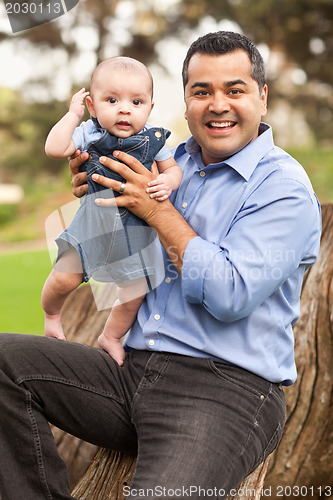 Image of Handsome Hispanic Father and Son Posing for A Portrait